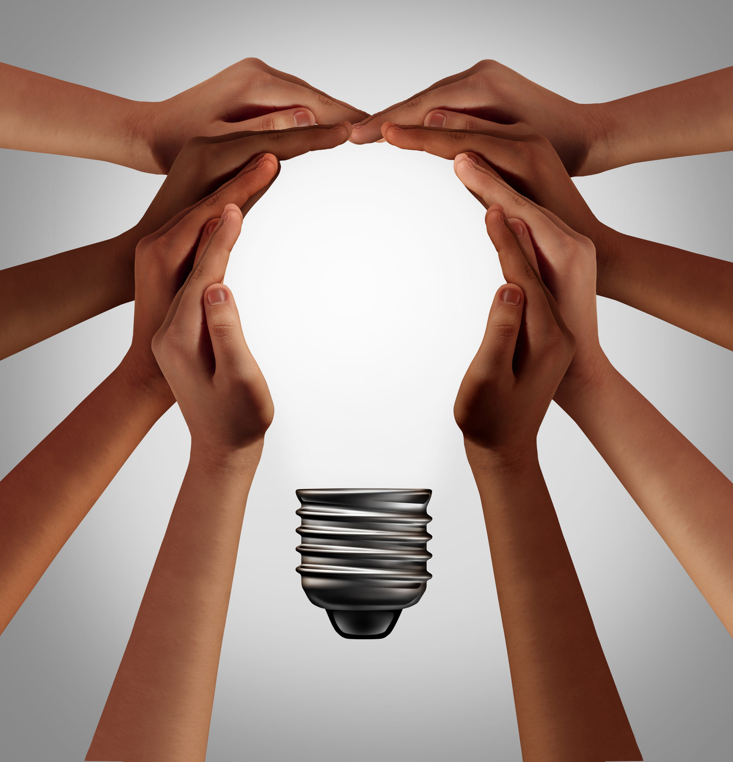 Hands coming together to form the shape of a light bulb.