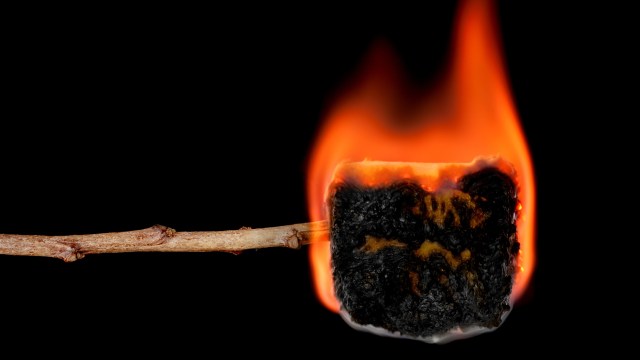 a burnt matchstick with a burnt matchstick sticking out of it.
