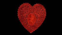A red, intricately patterned lace heart with a floral border and a cherub design in the center, set against a black background.
