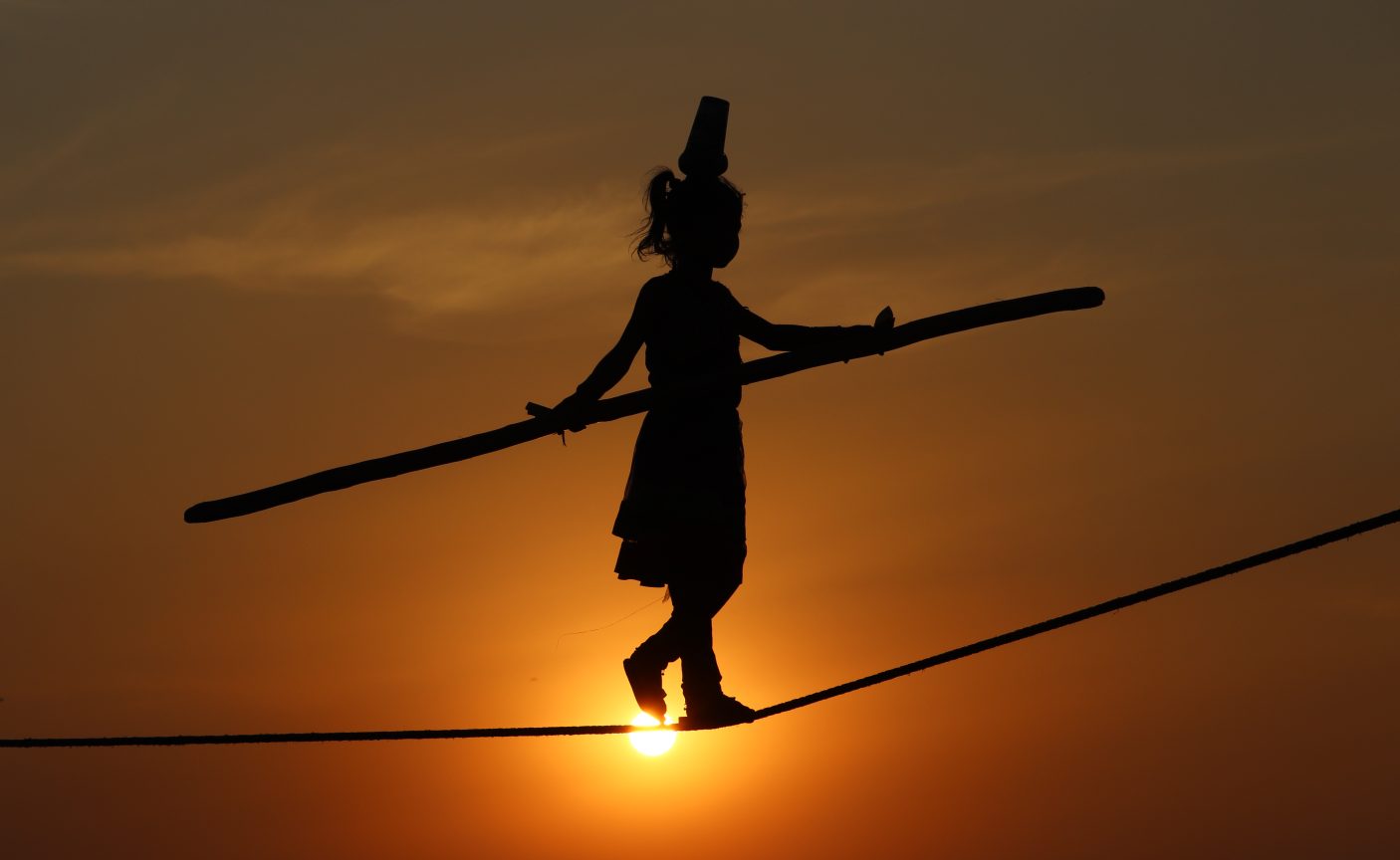 An Indian girl tightrope walks during the Baunsa Rani.