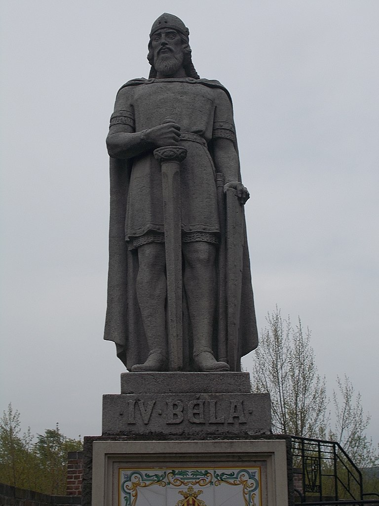 a statue of a man holding a staff.