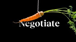 a carrot hanging from a string with the word negotiate on it.