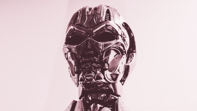 a close up of a robot head on a white background.