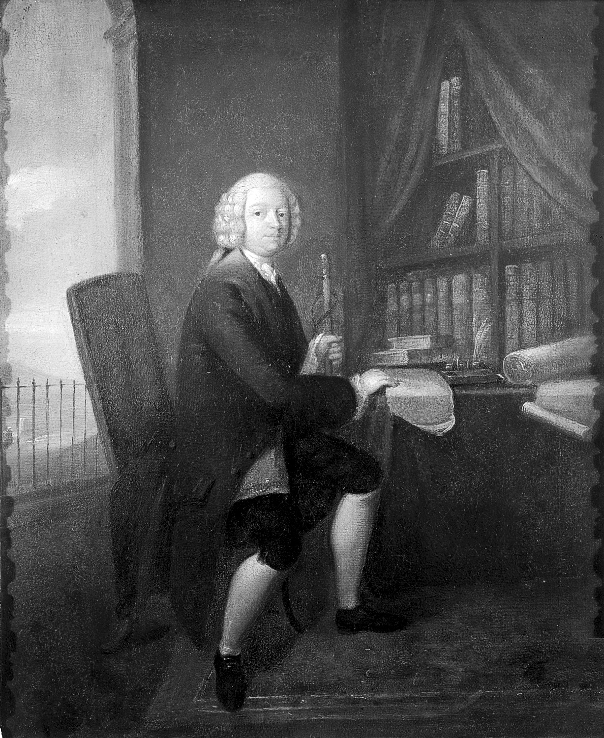 A portrait of a man sitting in a chair.