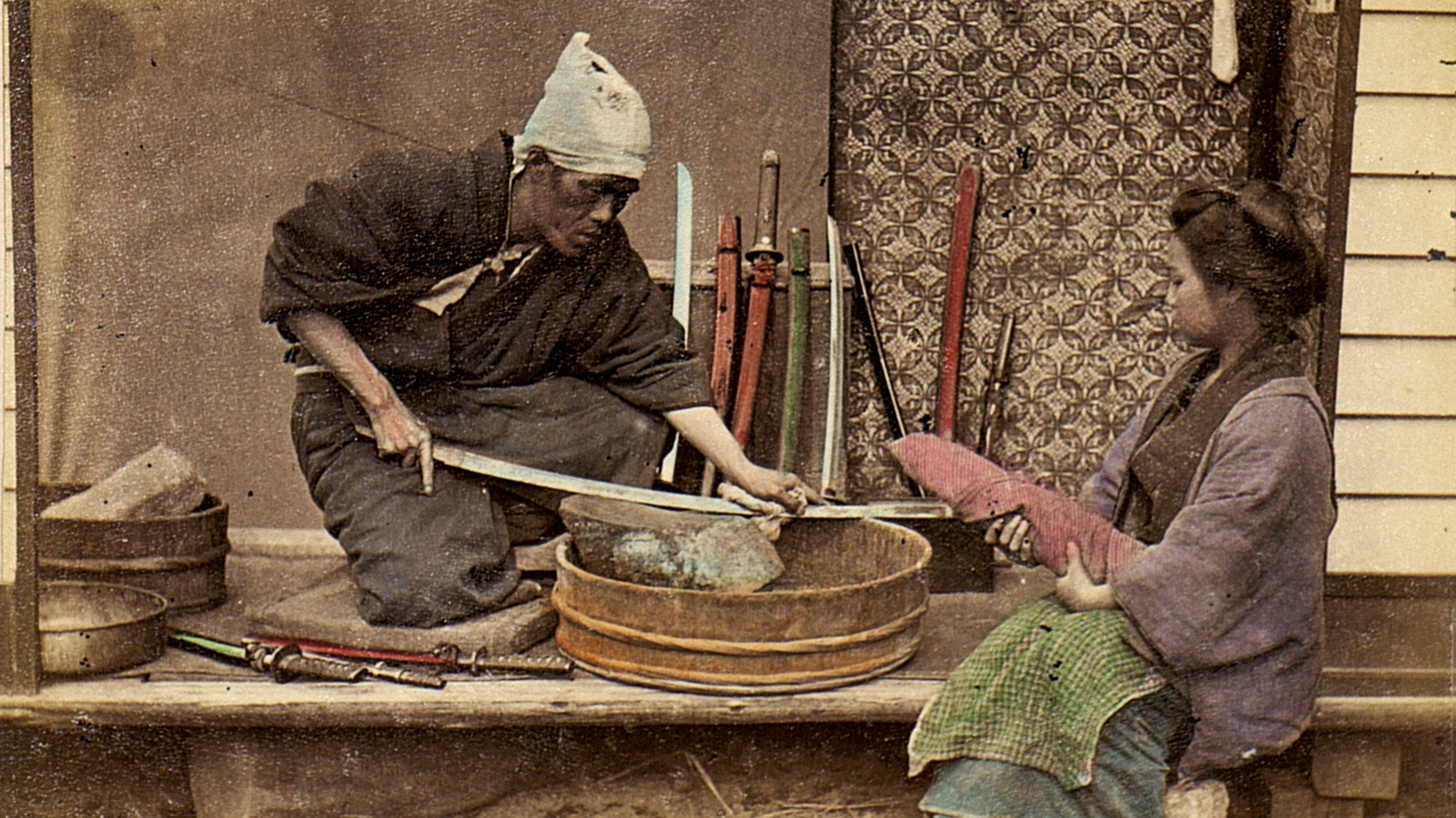 an old photo of a man and a woman working together.