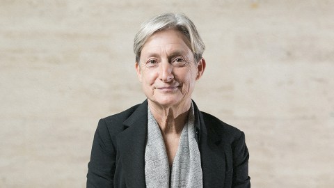 Judith Butler in a black jacket and grey scarf.