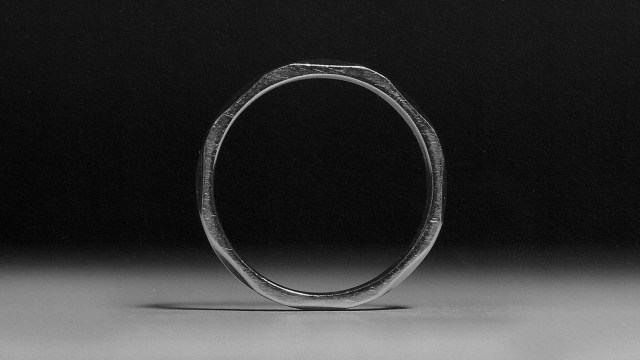 A monochromatic image capturing a silver ring.