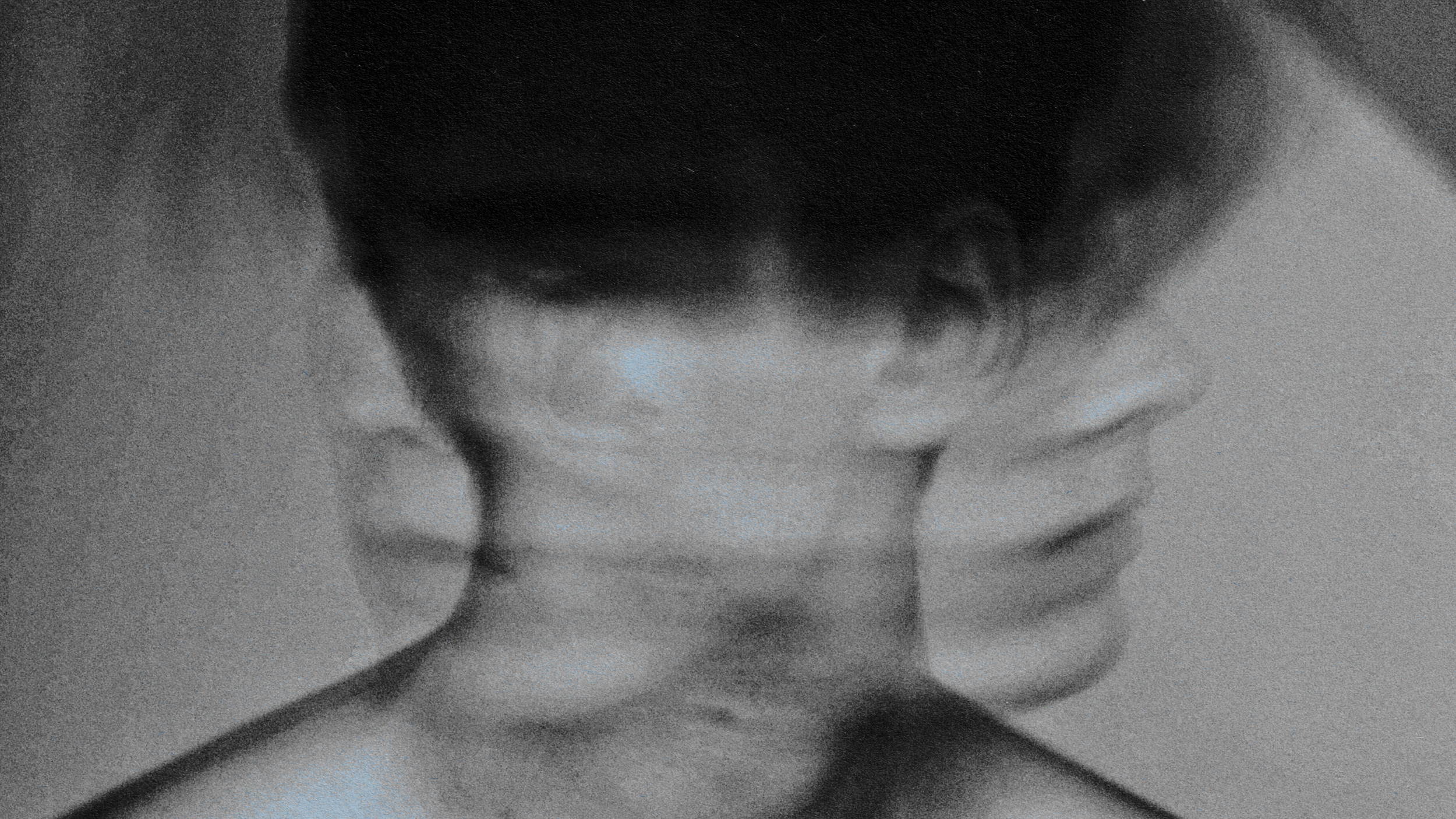 A monochrome portrait showcasing a man's head.