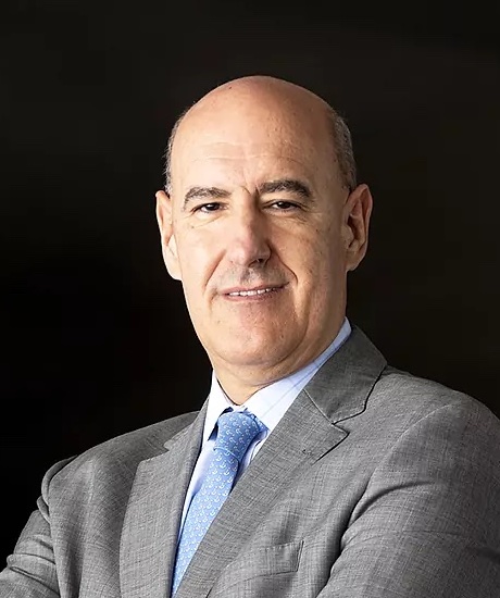 A bald man in a suit and tie.