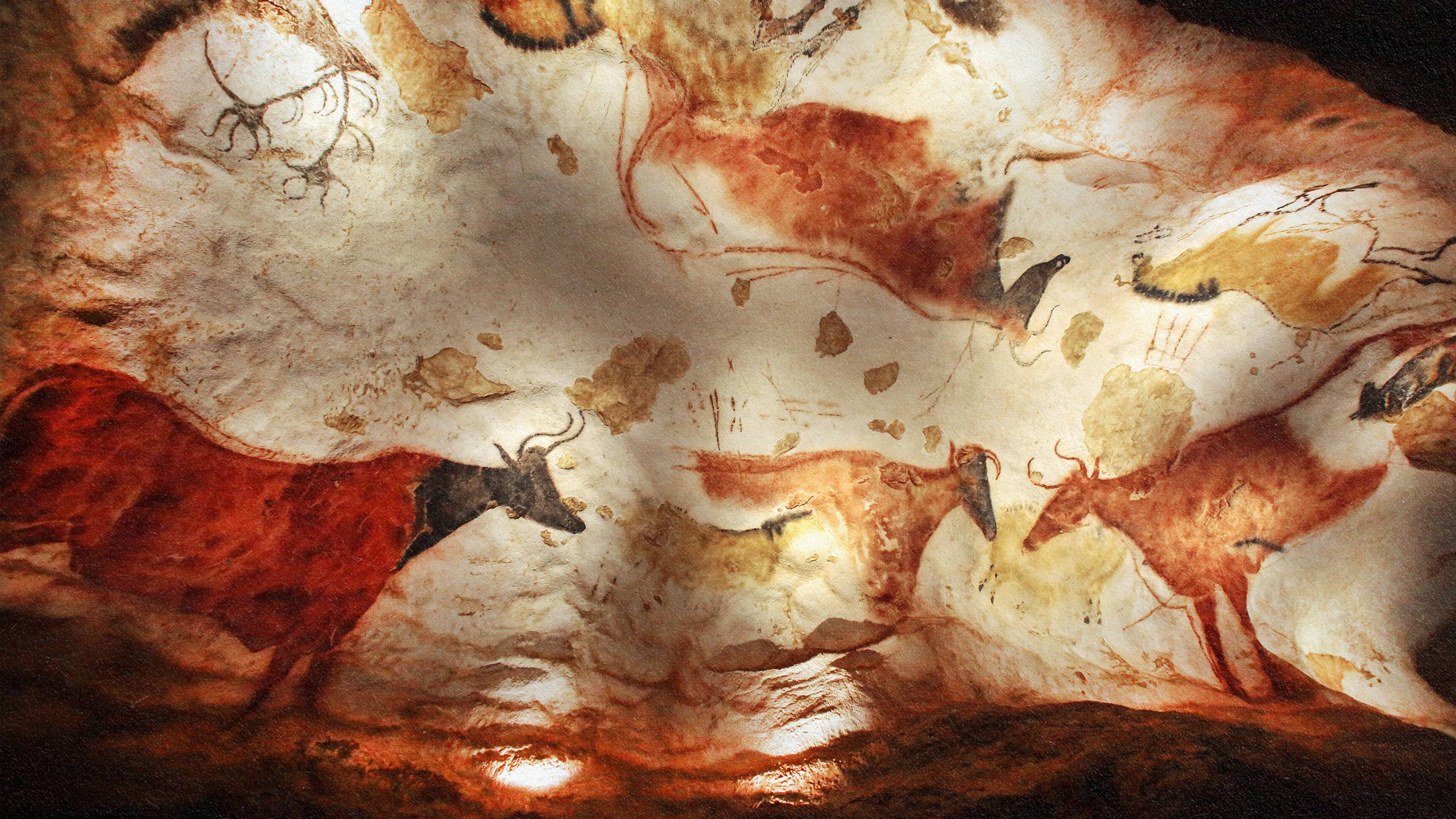 A scientifically-inspired painting of animals in a cave.