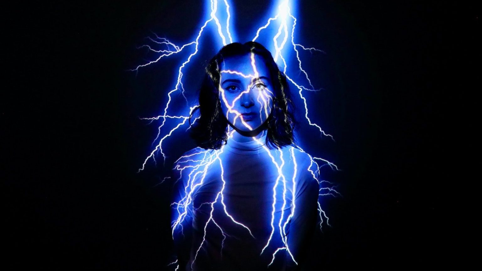 A woman with a blue lightning bolt in her face.