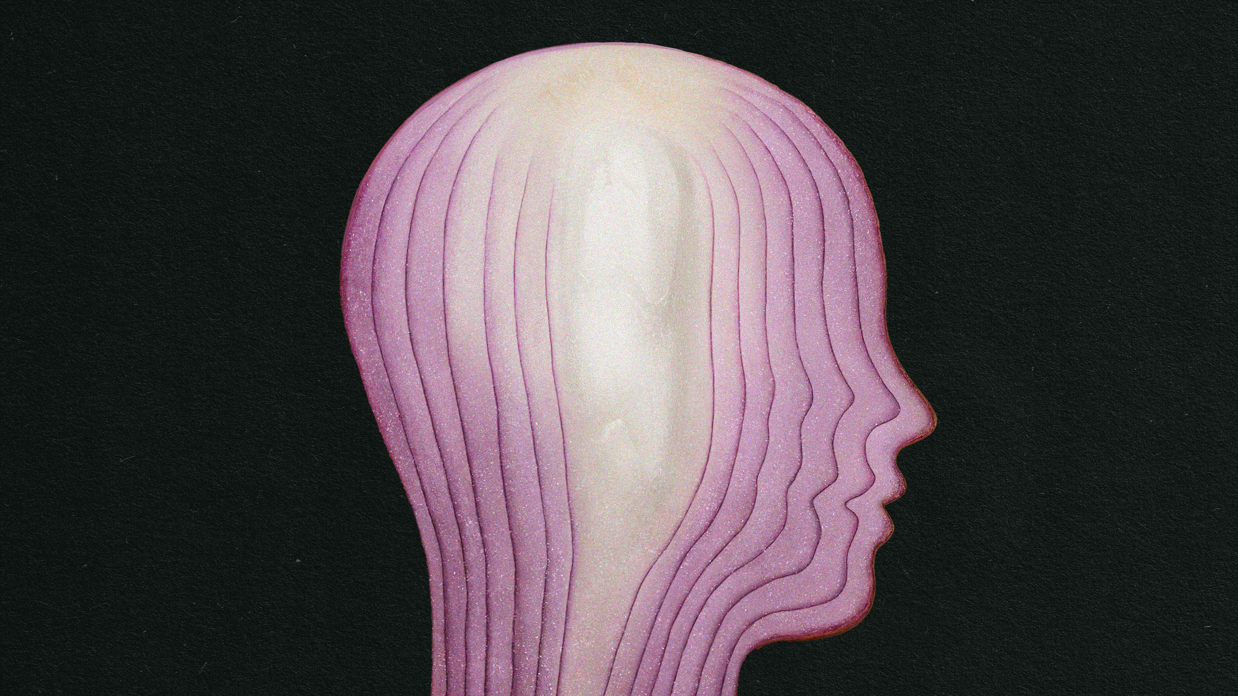 The head of an onion is shown on a black background.