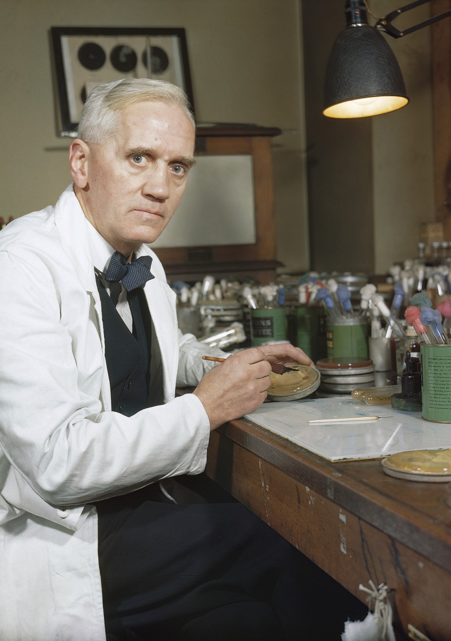 A man sitting at a table in a lab.