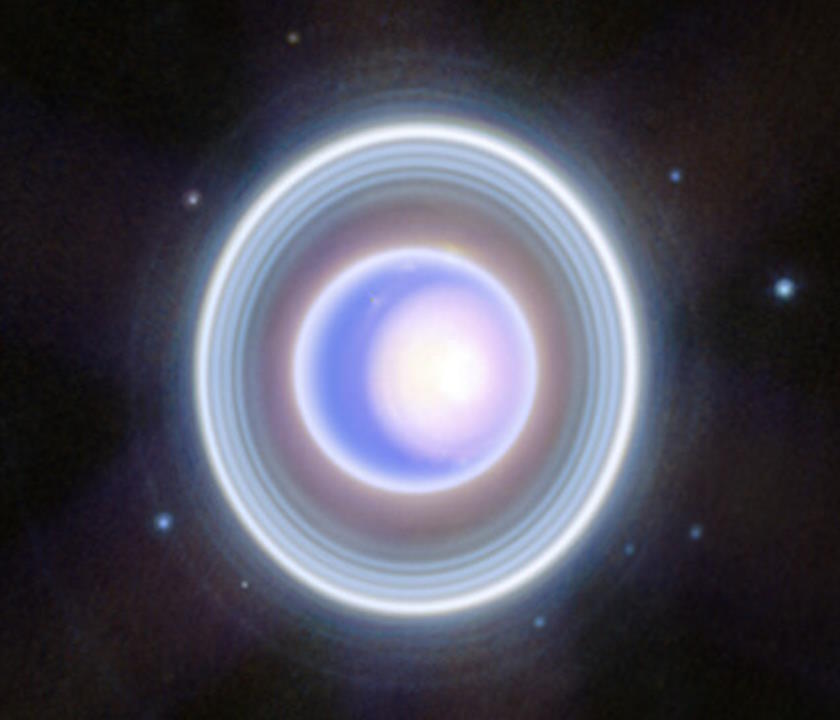 An artist's rendering of a blue ring around Uranus in space.