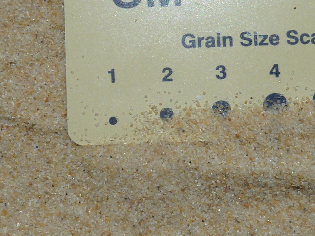 A sun grain size scale on a piece of sand.
