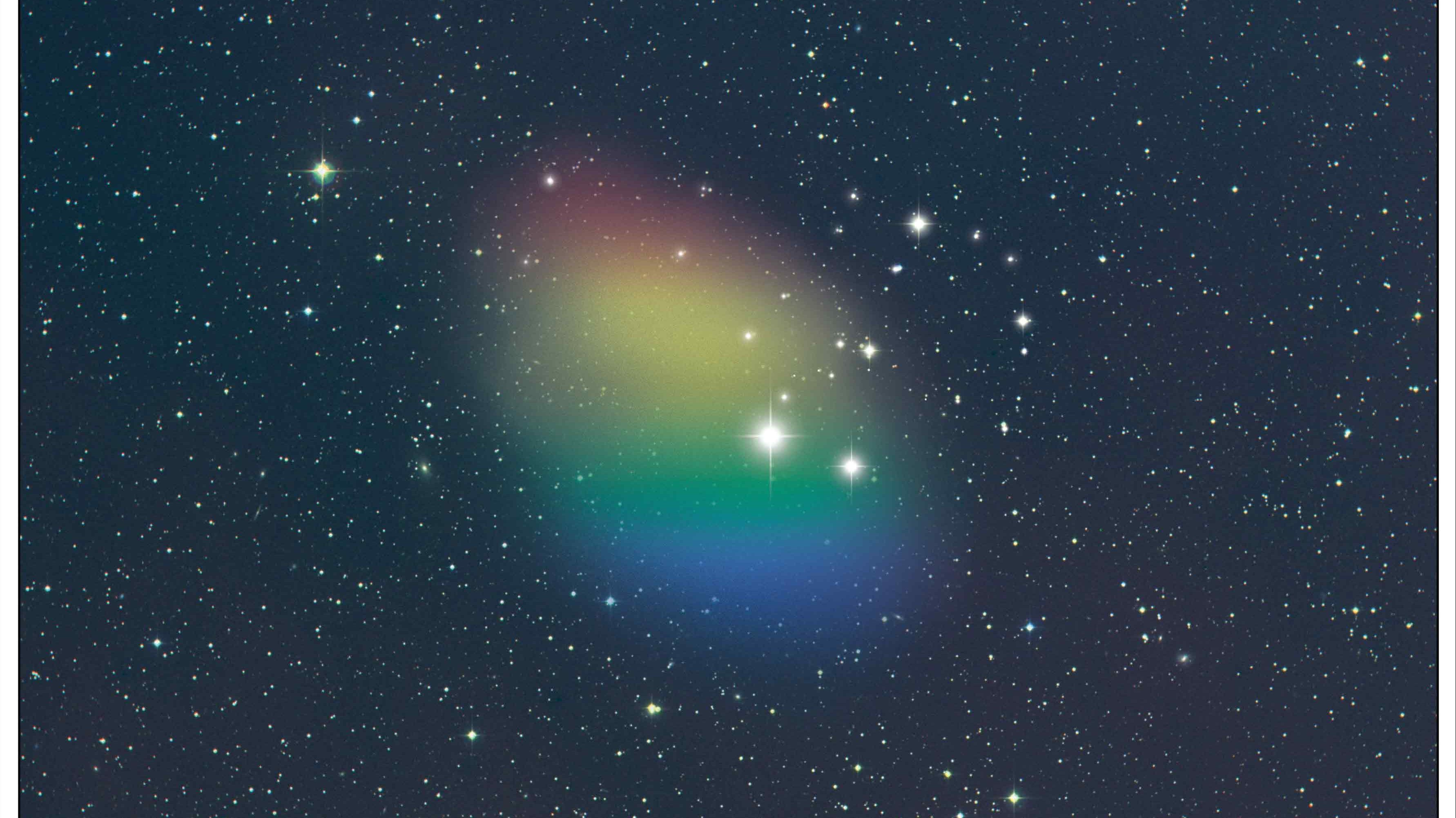 An image of a colorful object resembling a dark primordial galaxy in the sky.