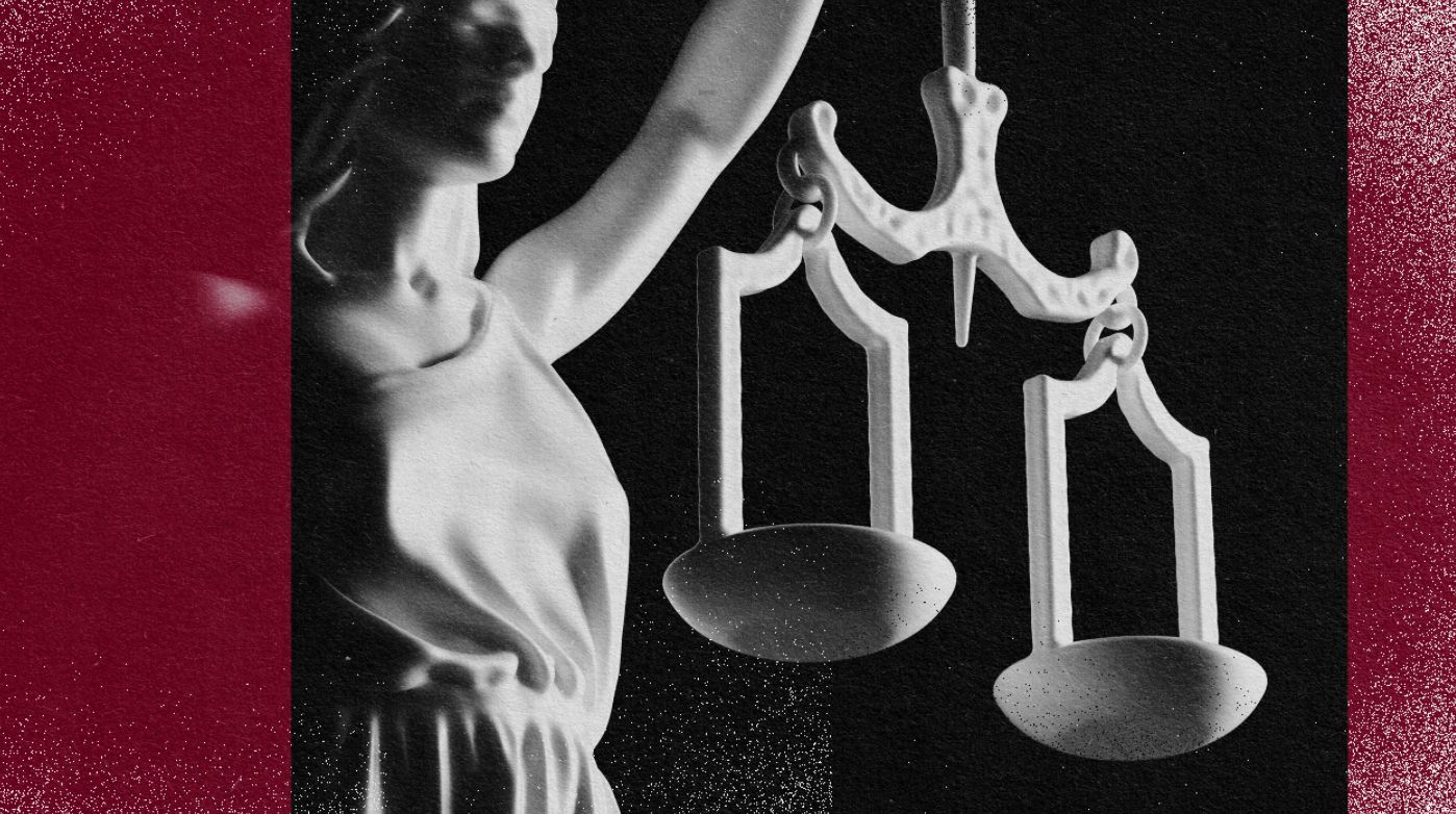 An image of a statue symbolizing human rights, delicately holding scales of justice.