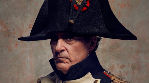 A man in a military uniform wearing a hat resembling Napoleon.