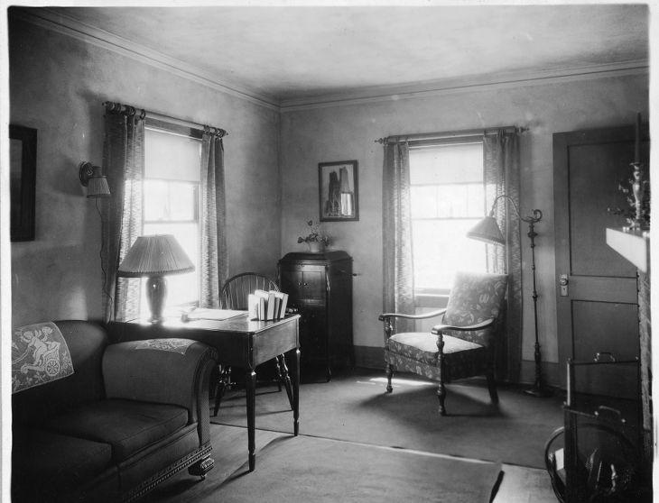A black and white photo of a living room.