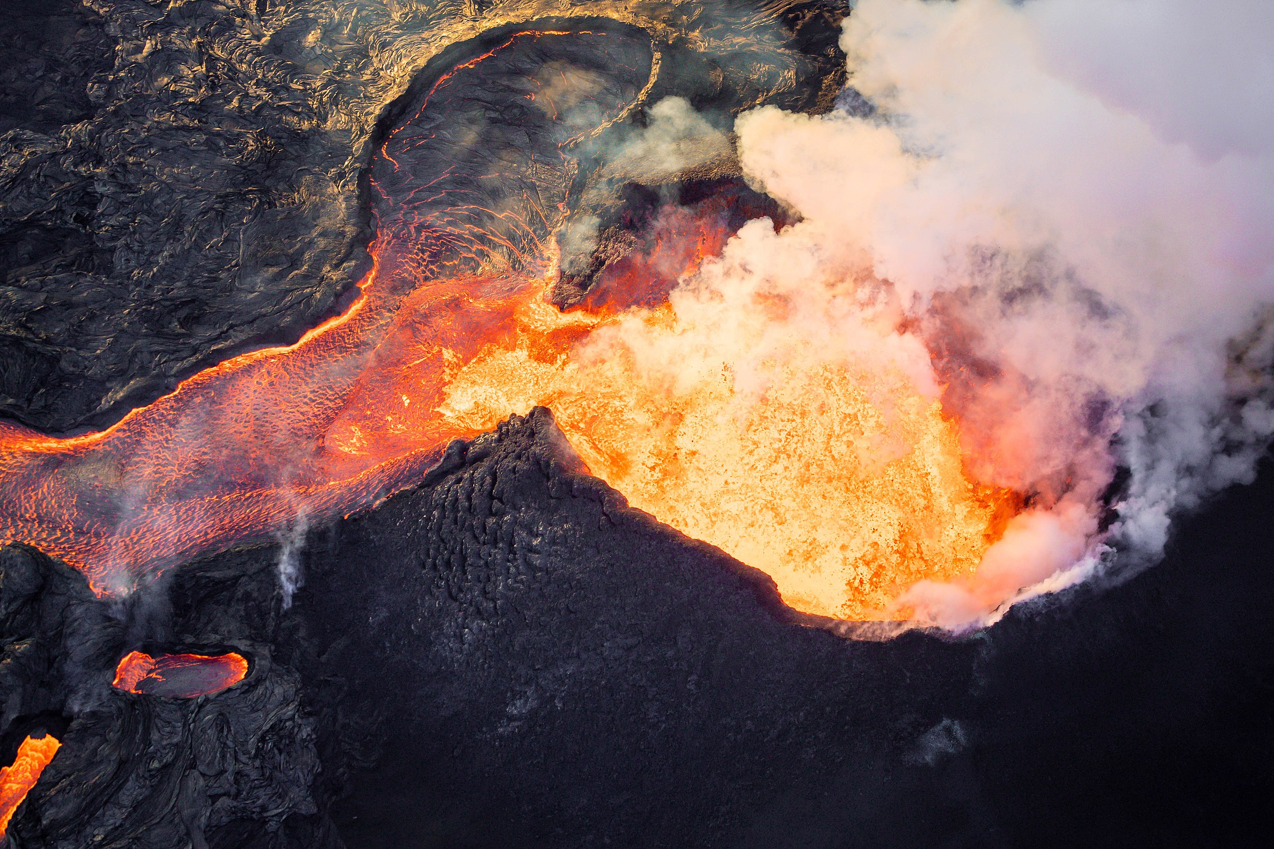 An aerial view of a lava flow showcasing the power of nature from a cosmic perspective.
