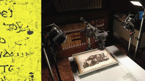 High-tech robotic arms equipped with cameras digitizing an ancient manuscript in a library.