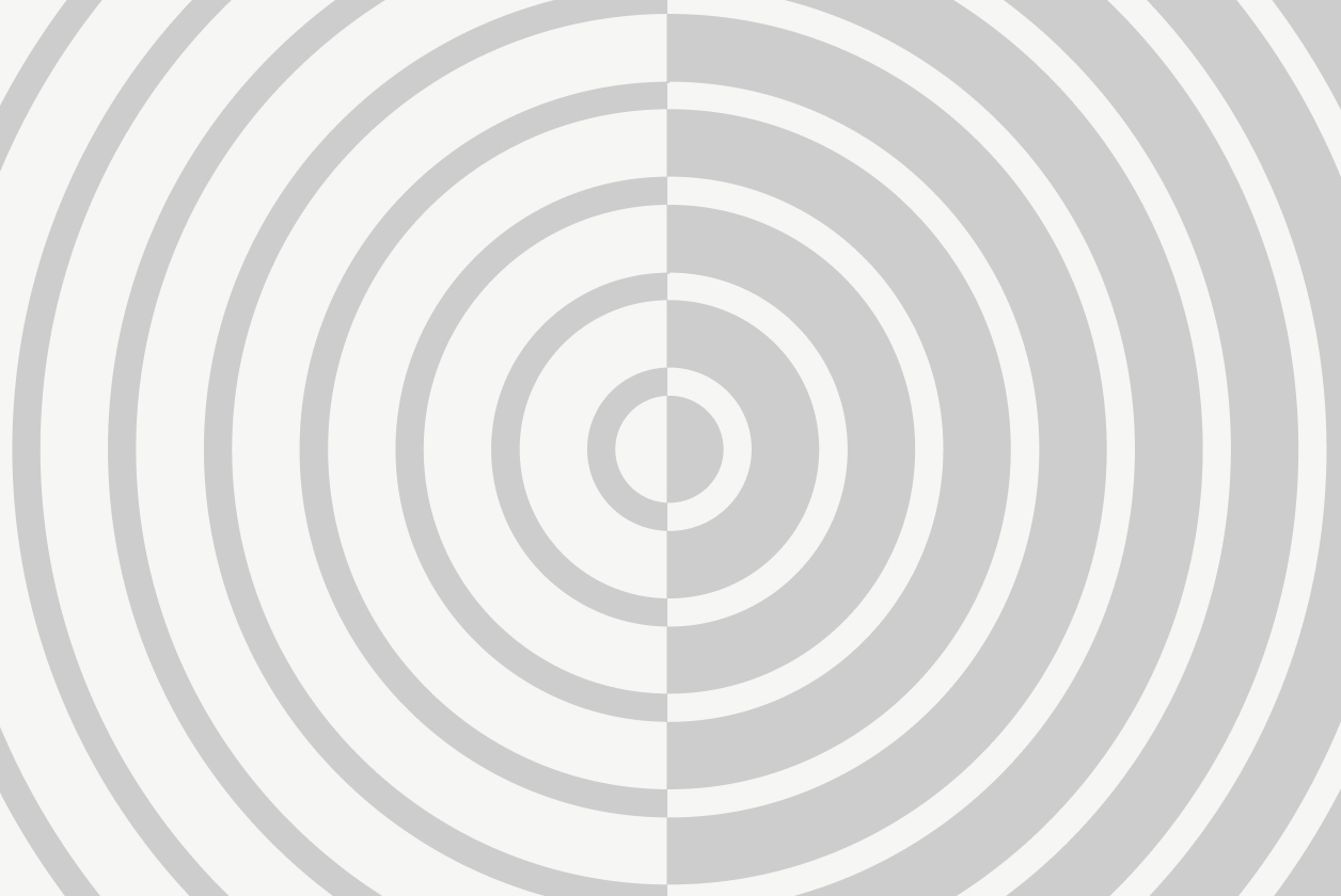 Concentric gray and white circles form an optical illusion pattern.