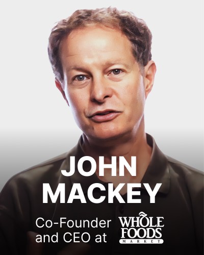 Man in a dark shirt with short hair, identified as John Mackey, Co-Founder and CEO of Whole Foods Market, is shown above the company logo on a light background.