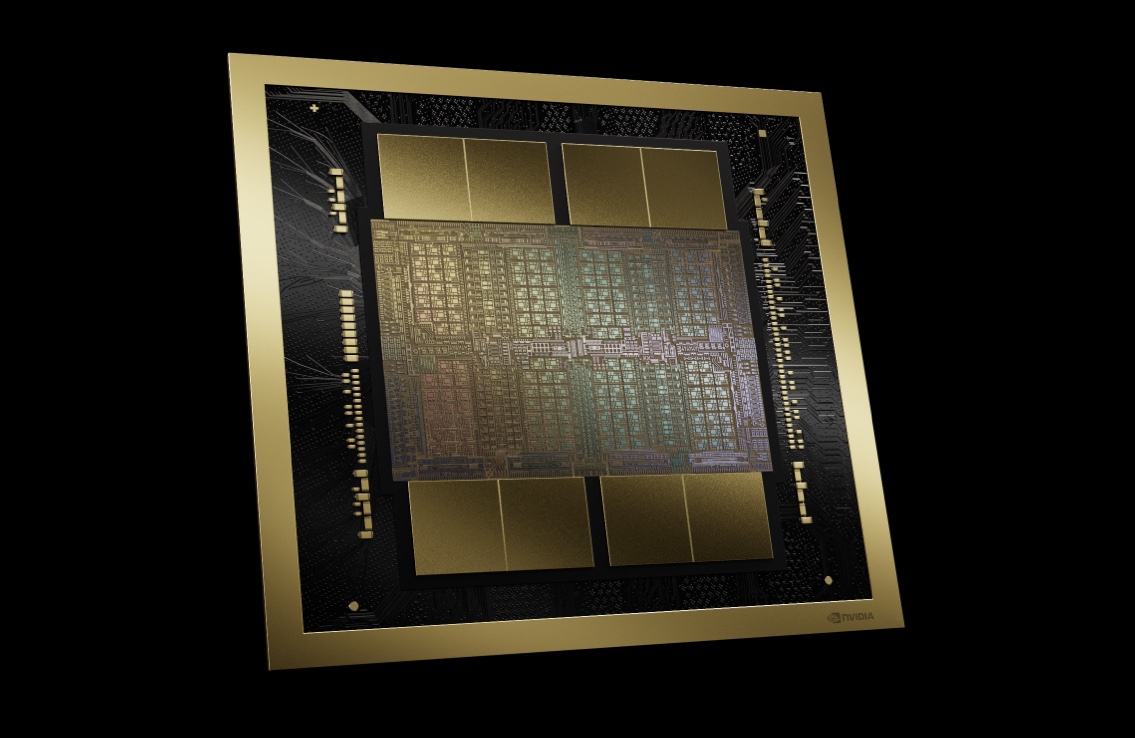 A gold-framed computer chip with intricate circuitry on a black background.