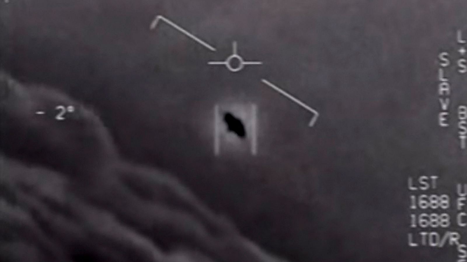 Grayscale image showing a flying object captured on radar screen with various data markings.