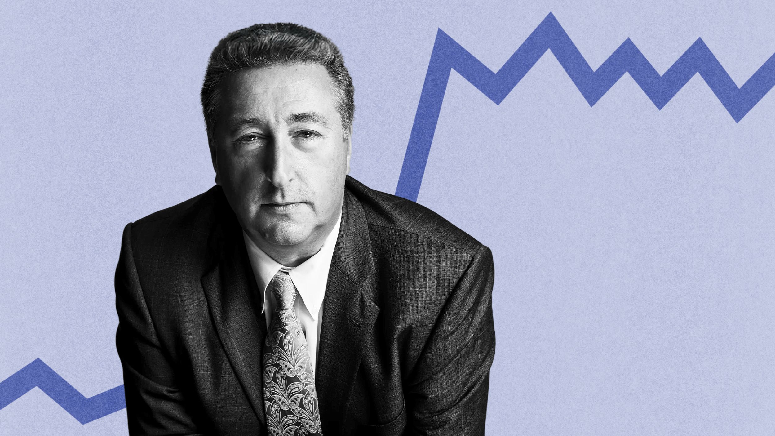 Barry Ritholtz, a man in a suit and tie, stands confidently before a blue zigzag line on a light backdrop.