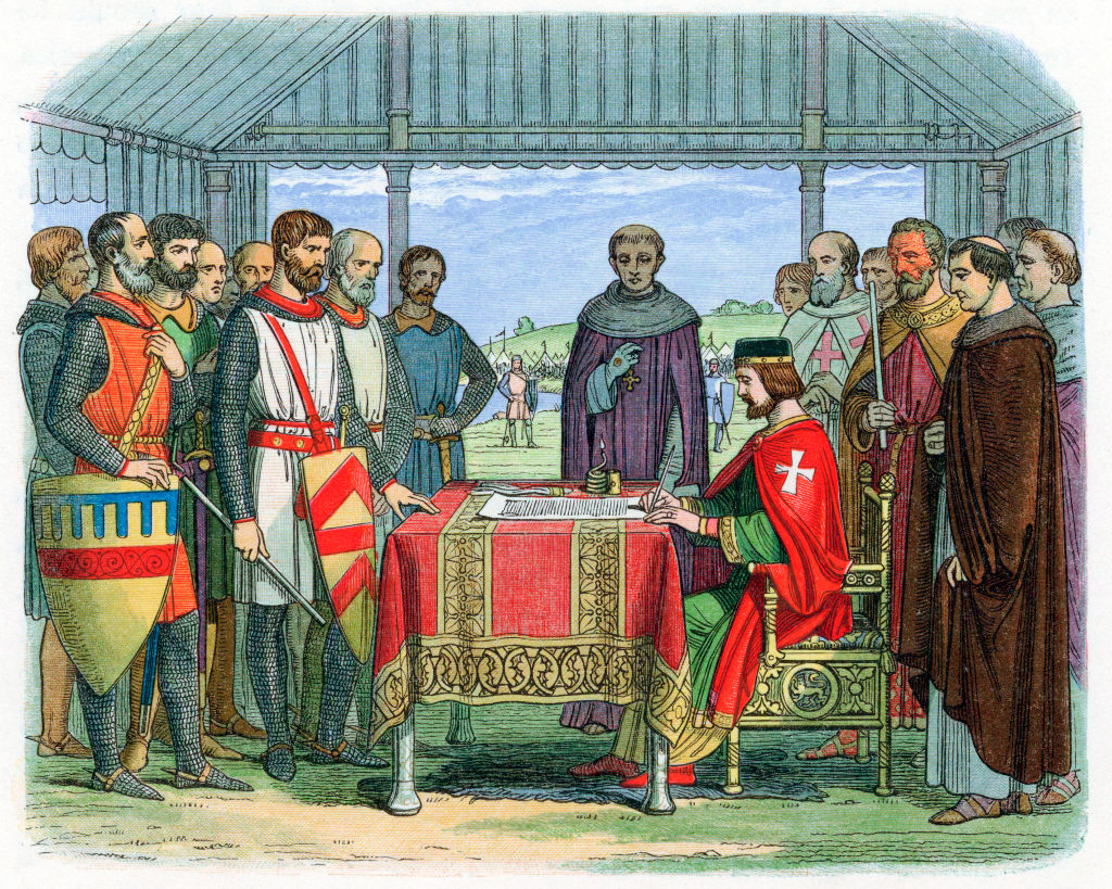 A medieval king sits at a table signing a document, surrounded by nobles and clerics in armor and robes inside an open tent.