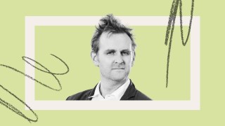 A man in a suit looks at the camera with a neutral expression, set against a light green background with abstract black scribble accents.